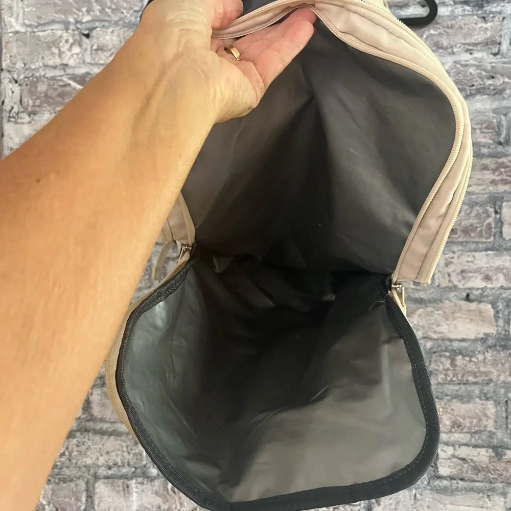 Elegant offwhite Travel carry on Backpack.So many compartments, zippers allwork🌸